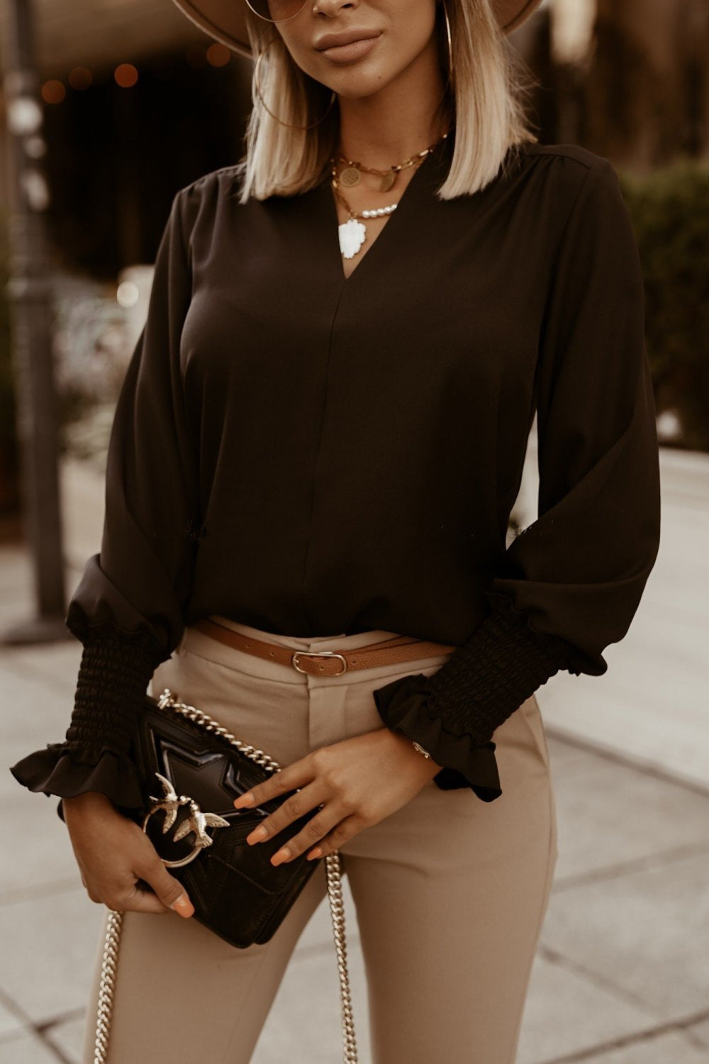 Wear a V-neck blouse for ladies
